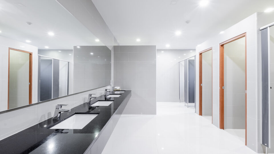 public Interior of bathroom with sink basin faucet lined up Modern design.